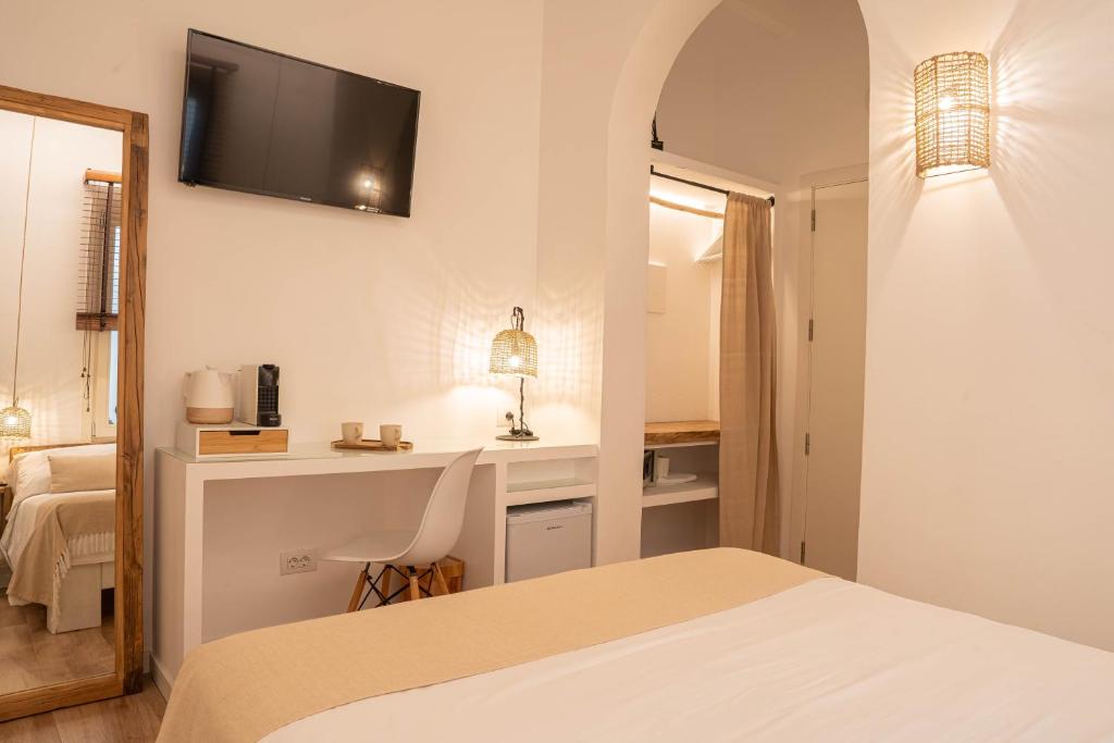 Posteľ alebo postele v izbe v ubytovaní Hotel Los 5 Sentidos