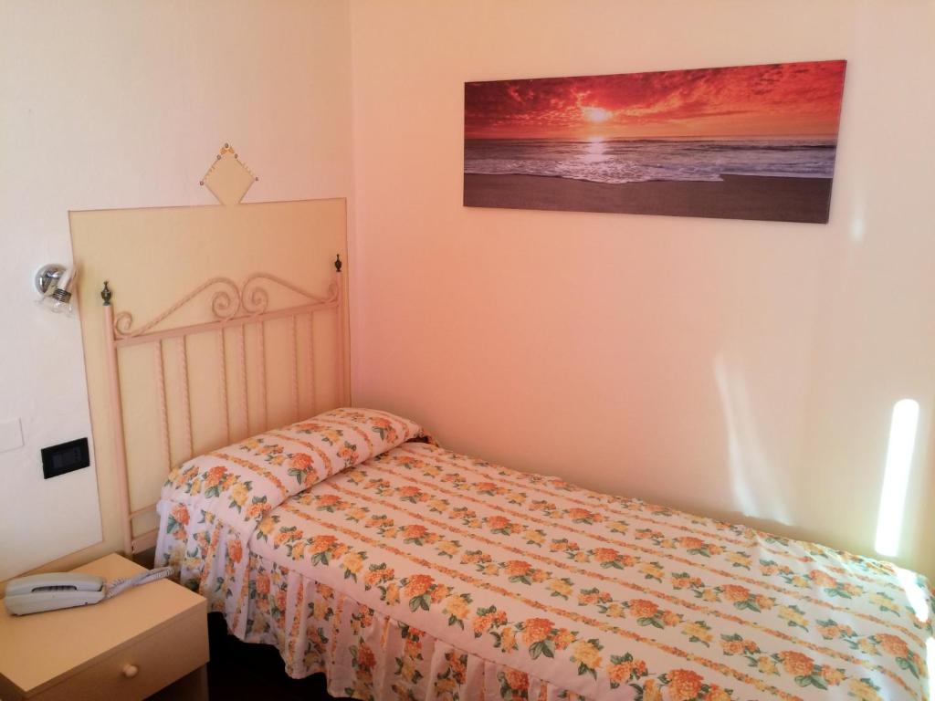 Postel nebo postele na pokoji v ubytování Lungomare Hotel