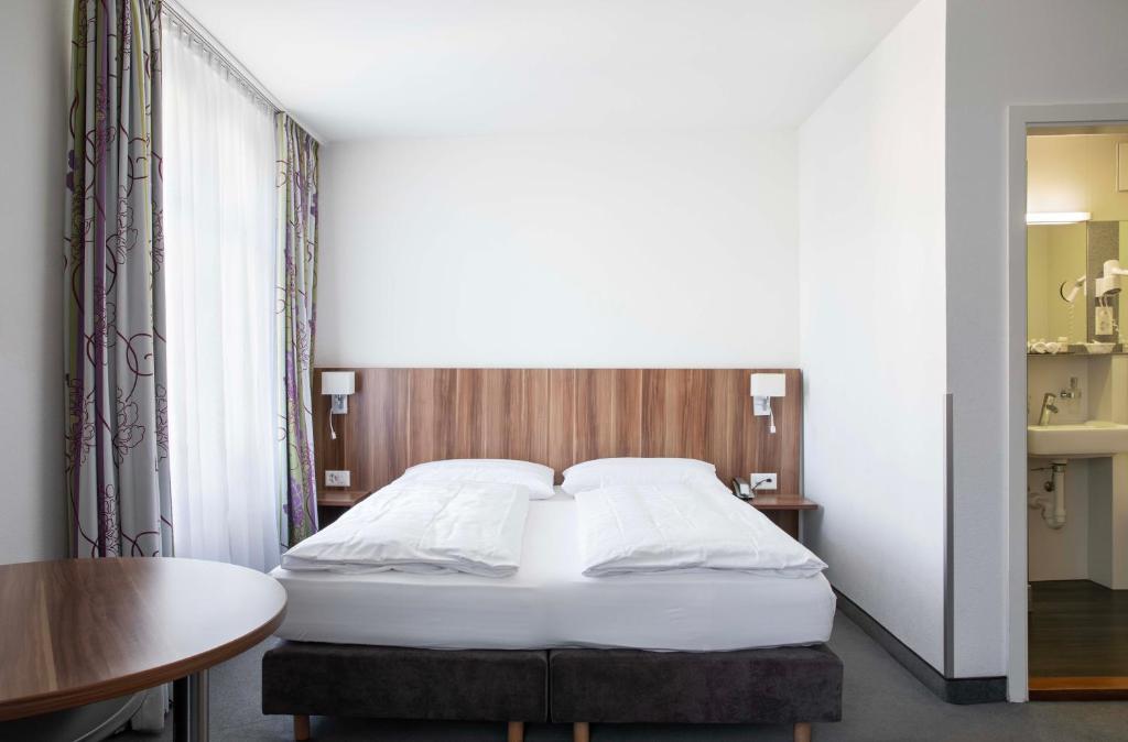 Postel nebo postele na pokoji v ubytování Hotel Resslirytti