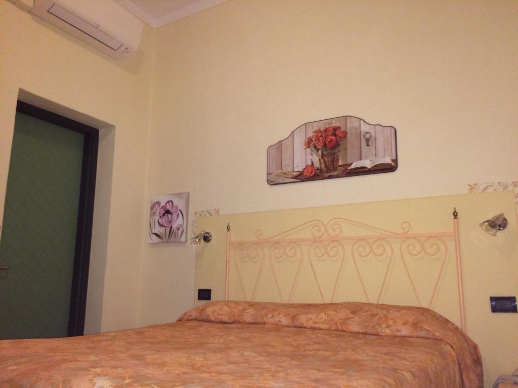 Postel nebo postele na pokoji v ubytování Lungomare Hotel