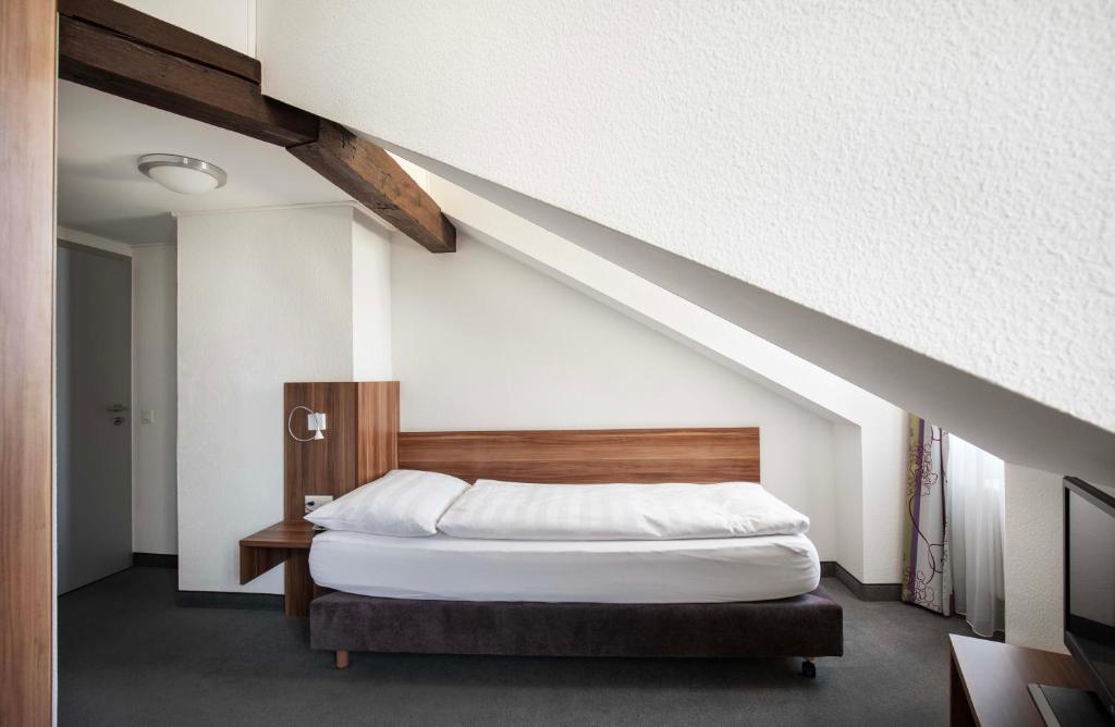 Postel nebo postele na pokoji v ubytování Hotel Resslirytti