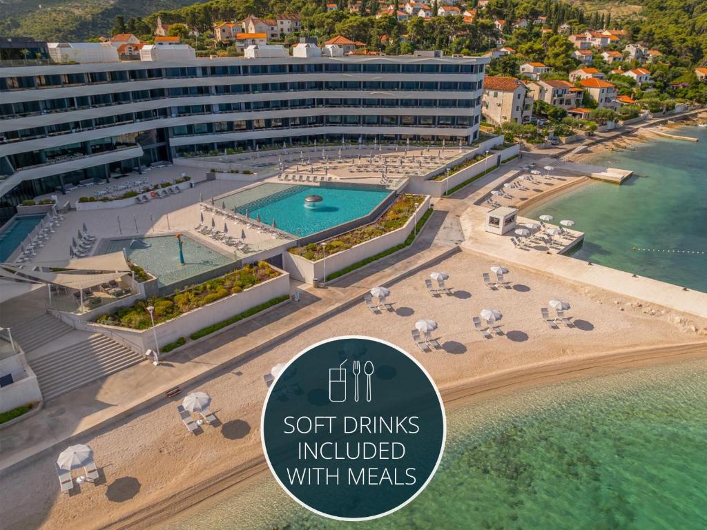 an aerial view of a resort with a beach and a hotel at Grand Hotel View in Postira