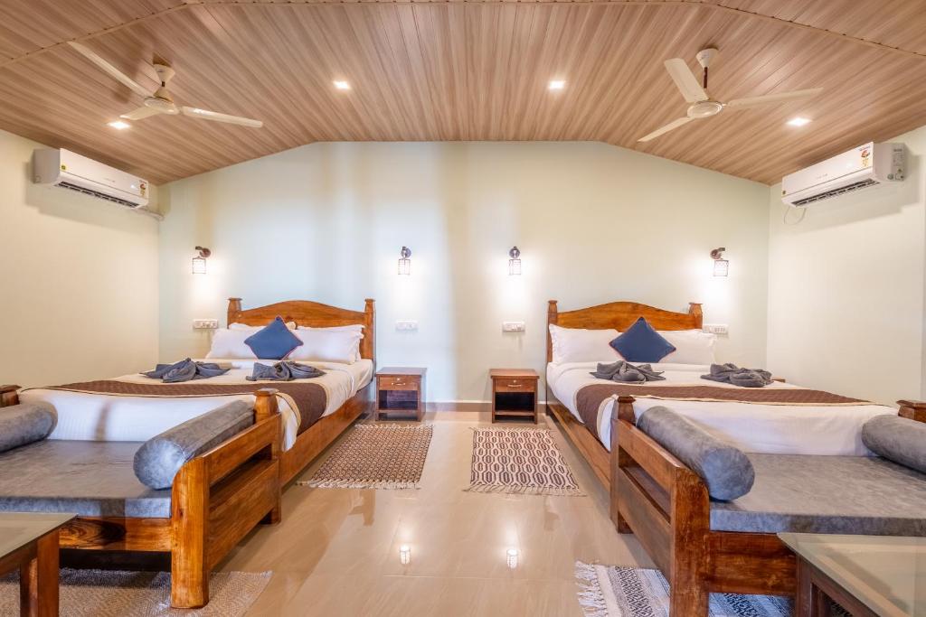 Postel nebo postele na pokoji v ubytování Goa Beach Villa