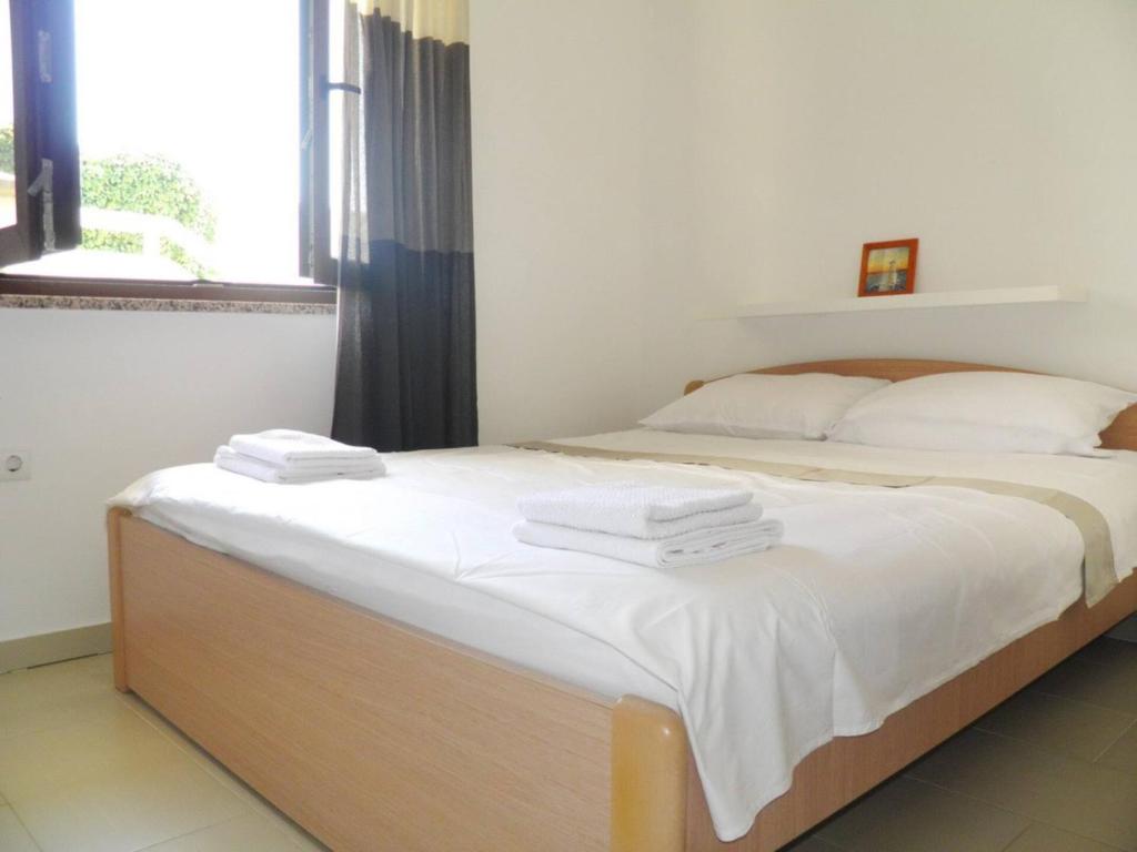 Łóżko lub łóżka w pokoju w obiekcie Apartment Starcevic Filipovic