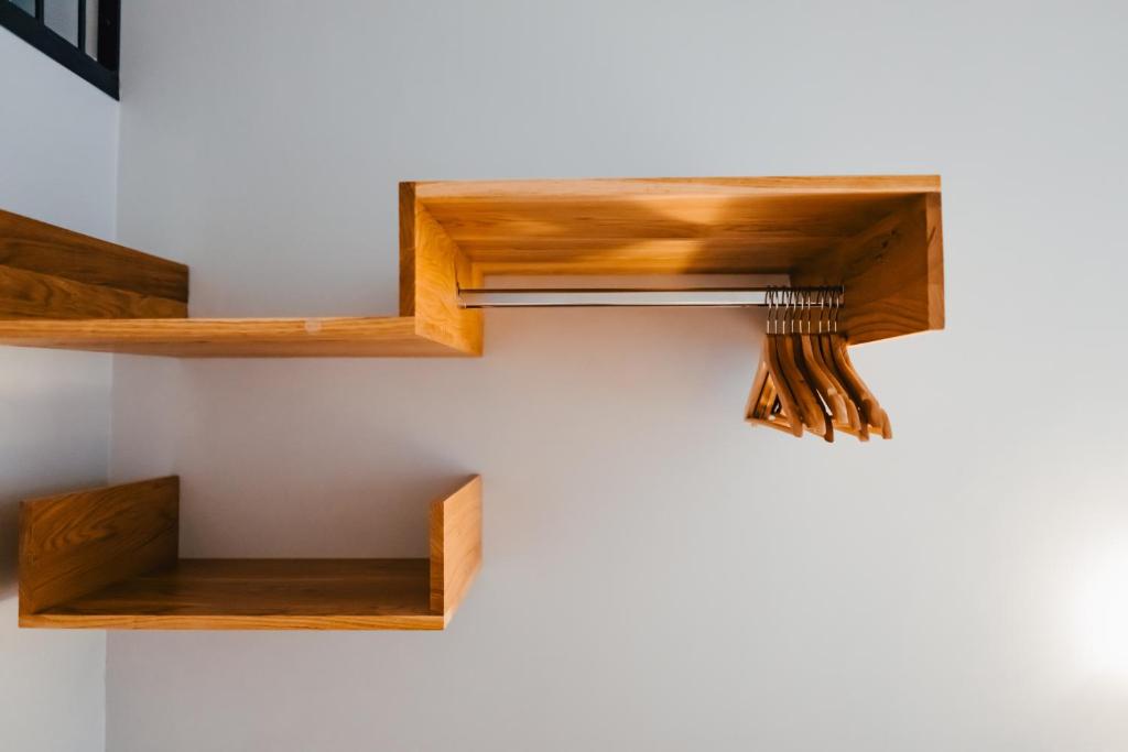 a room with wooden shelves on the wall at The Layhead B&B in Lübeck