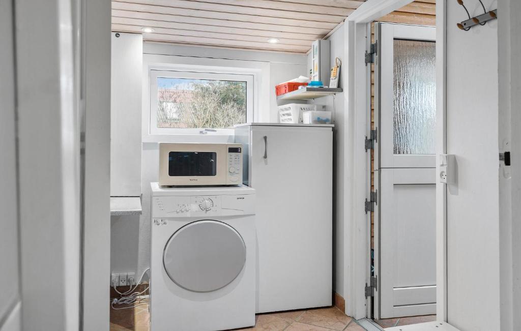 Kuchyň nebo kuchyňský kout v ubytování Holiday Home Slusevej
