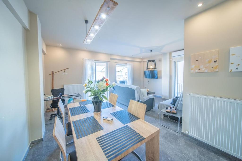 a dining room with a table and chairs at City Center Apartment Project by Cretan Houses in Heraklio