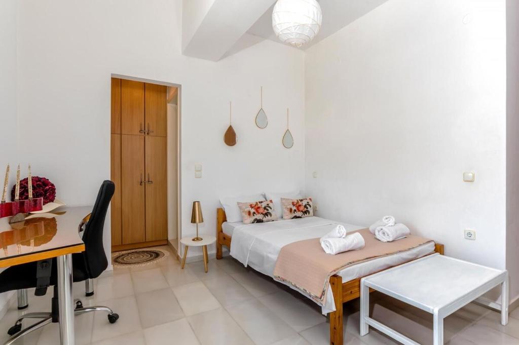 Postel nebo postele na pokoji v ubytování Marele Apartment City Center by Cretan Houses
