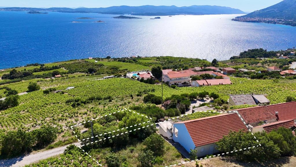 an aerial view of a small village next to the water at Villa More in Postup