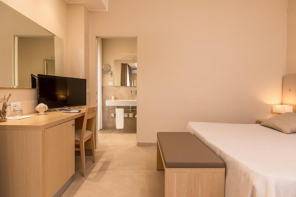 Postel nebo postele na pokoji v ubytování Hotel Degli Aranci