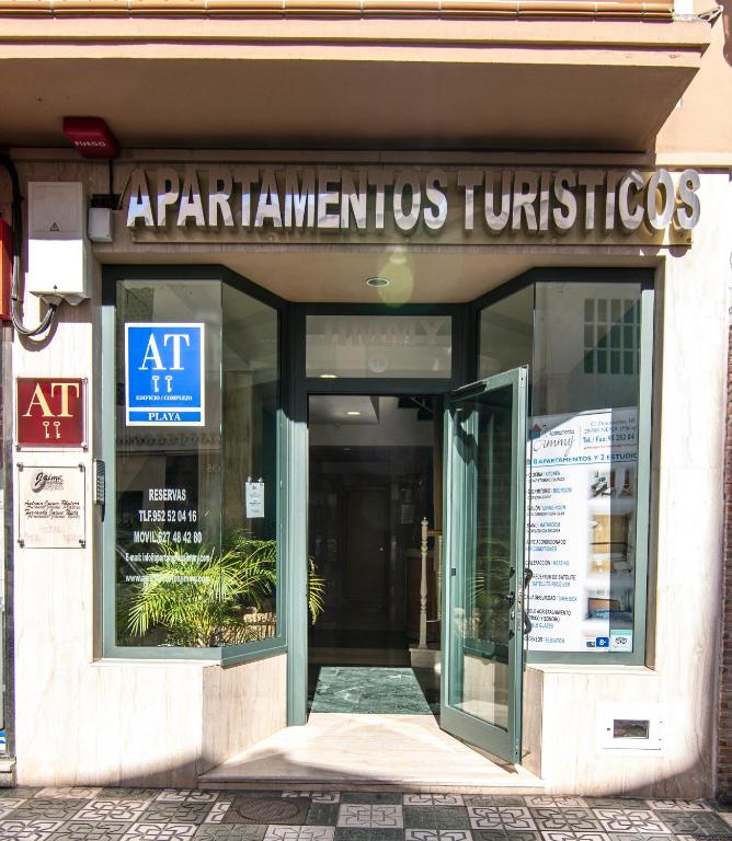 an entrance to an art museum with a sign on it at Apartamentos Jimmy in Nerja