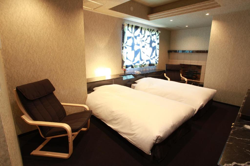 Postel nebo postele na pokoji v ubytování Hotel In Kyoto Sasarindou