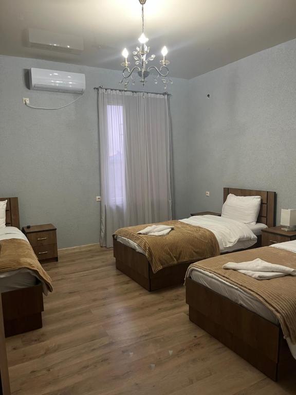 Postel nebo postele na pokoji v ubytování Hotel Shogi