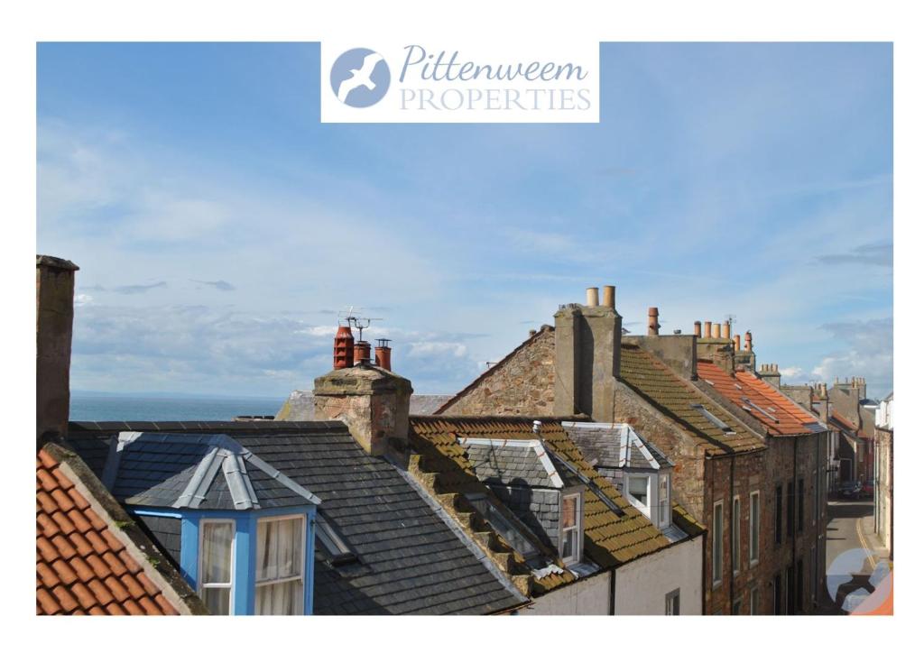 a view of roofs of buildings in a city at James Haven- coastal townhouse East Neuk in Anstruther