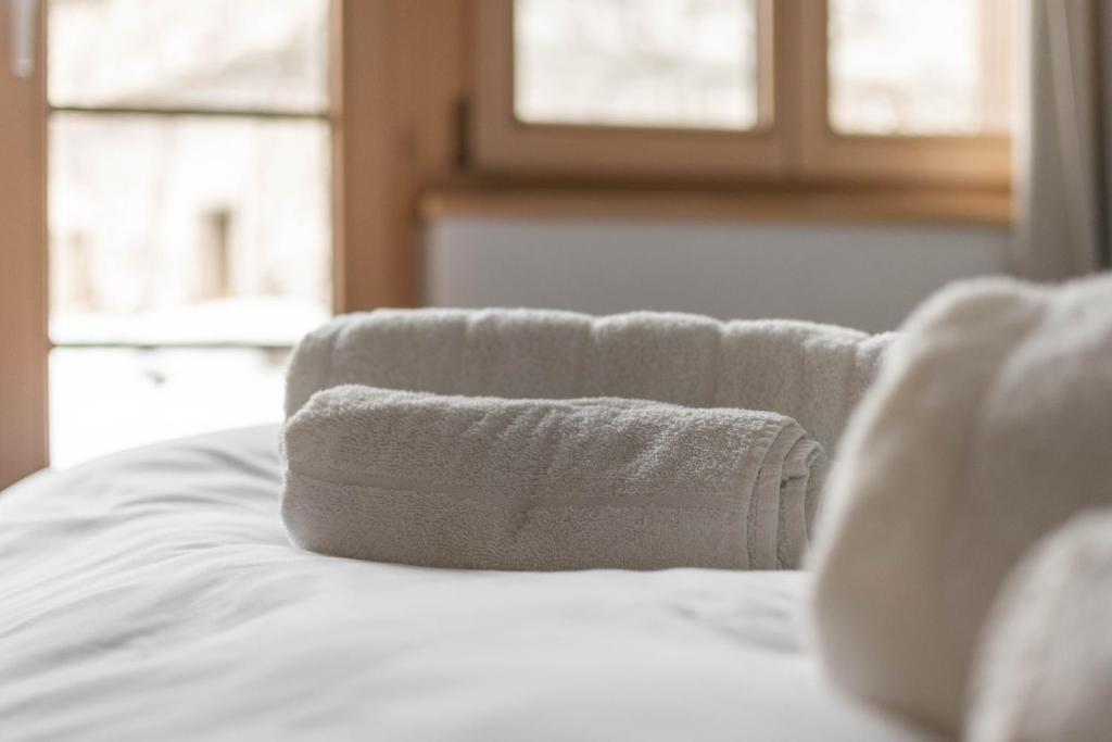 Postel nebo postele na pokoji v ubytování Wohnung Homely - Nähe Grindelwald Terminal
