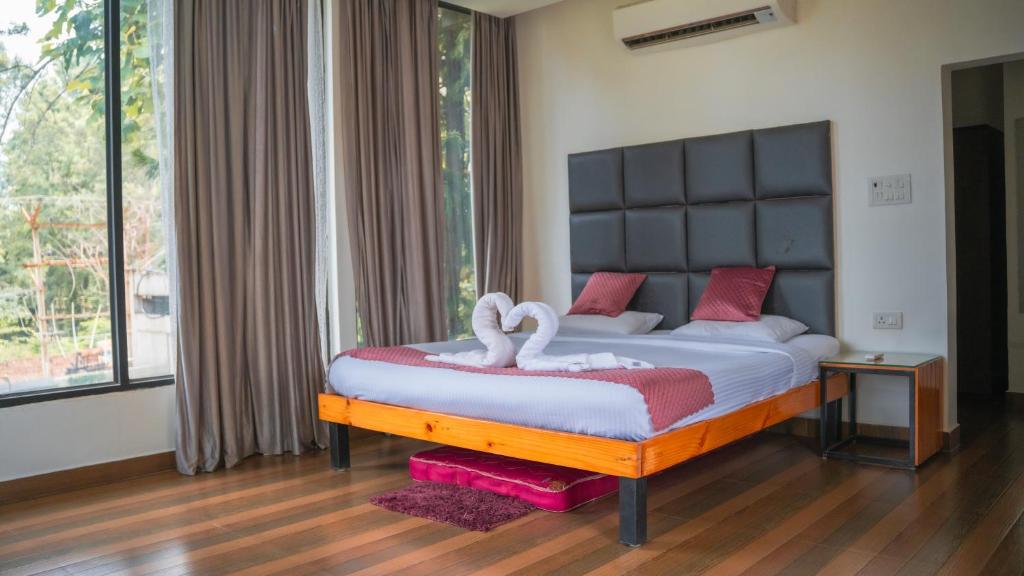 Ένα ή περισσότερα κρεβάτια σε δωμάτιο στο Thavika Silverwoods Residence
