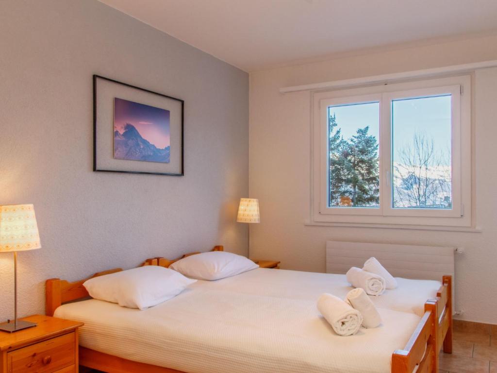 Postel nebo postele na pokoji v ubytování Apartment Montfort 9A by Interhome