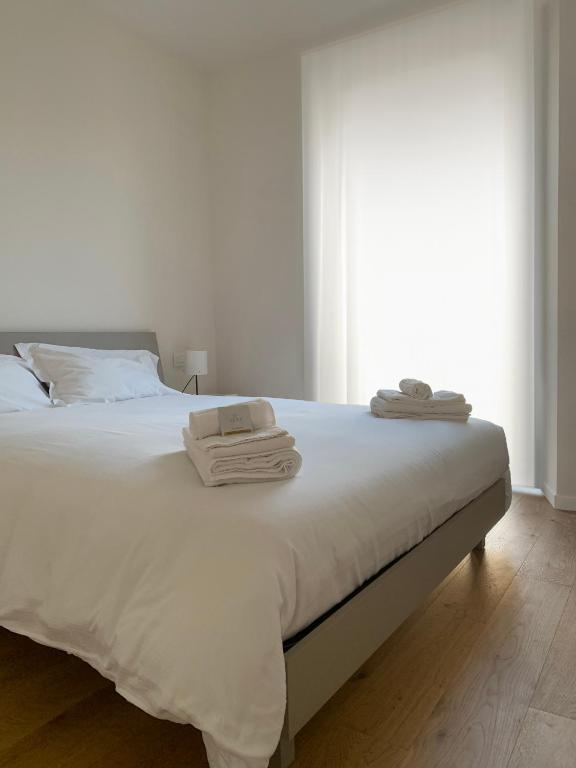 Postel nebo postele na pokoji v ubytování Spazio Perlasca Apt 2 - Cernobbio Como Lake