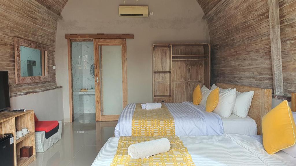 Postel nebo postele na pokoji v ubytování Daghan Cottage Nusa Penida