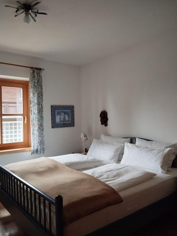 Posteľ alebo postele v izbe v ubytovaní Apartments Pfeffermühle - Kärnten Card im Sommer inklusive