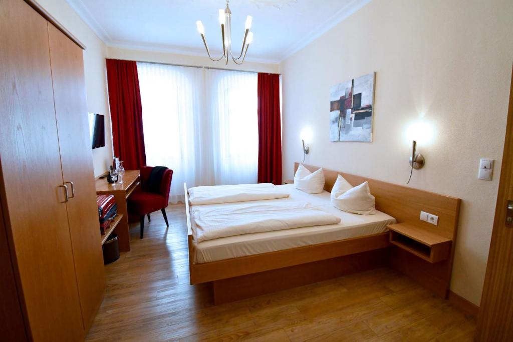 Postel nebo postele na pokoji v ubytování AKZENT Hotel Grüner Baum