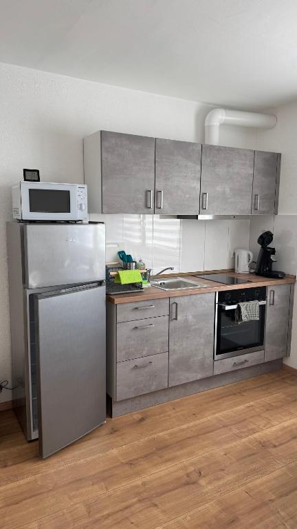 Kuchyň nebo kuchyňský kout v ubytování Gästezimmer Fateev 4