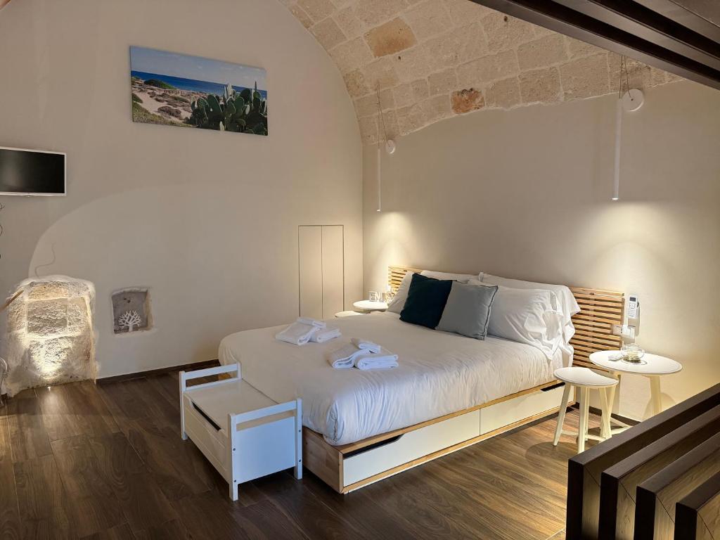 a bedroom with a large bed in a room at La Casupola by MONHOLIDAY in Monopoli