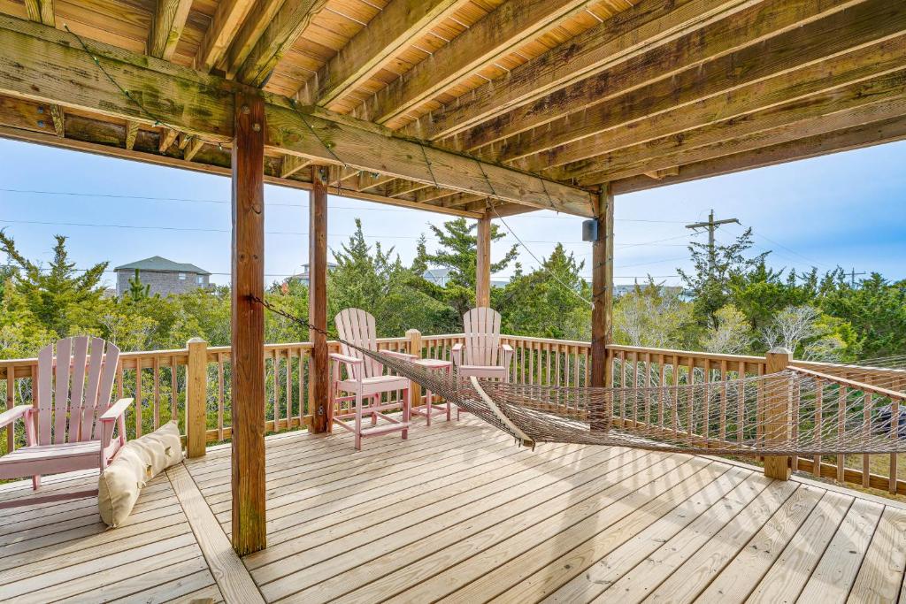 a porch with rocking chairs and a hammock on it at Rooftop Deck and Hot Tub Outer Banks Family Getaway in Rodanthe