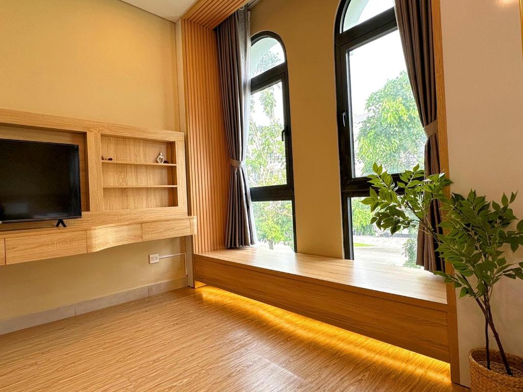 TV a/nebo společenská místnost v ubytování The Sol Homestay Grand World