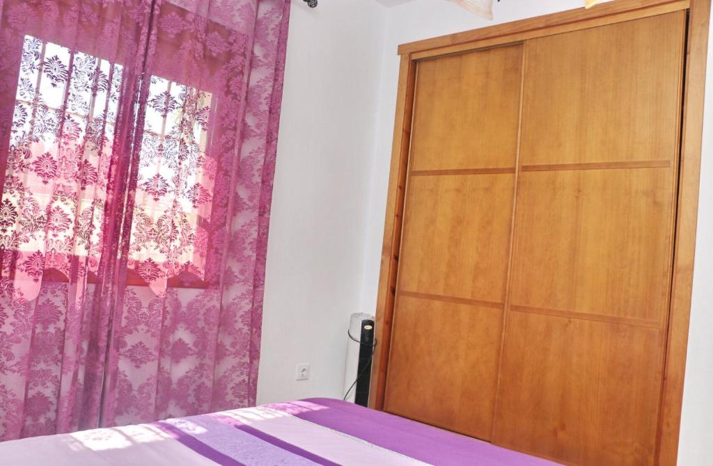 Łóżko lub łóżka w pokoju w obiekcie Chalet Vigía 114