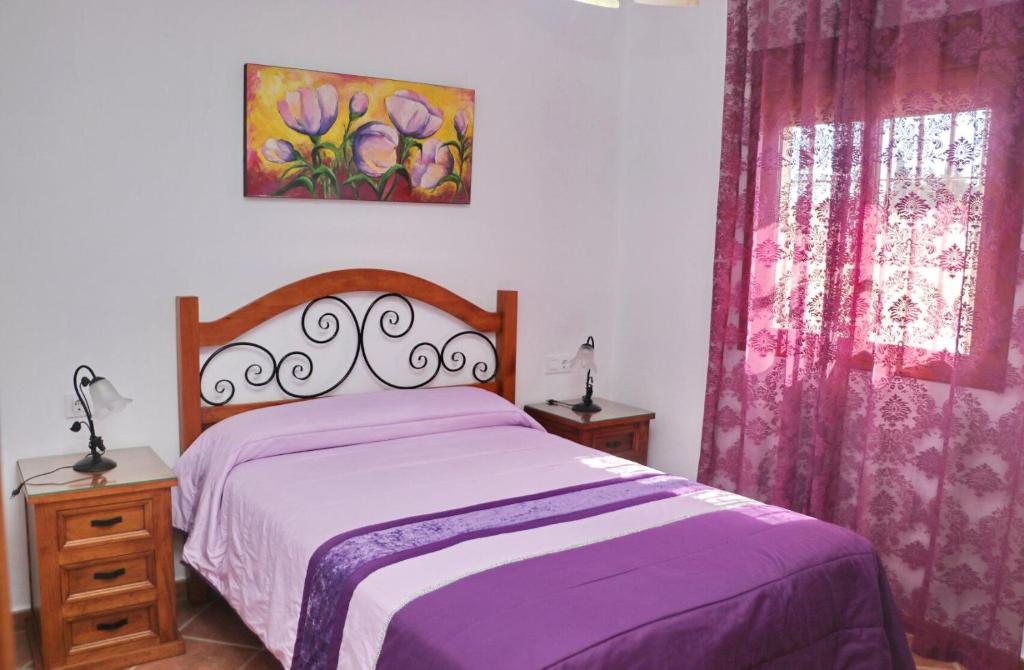Łóżko lub łóżka w pokoju w obiekcie Chalet Vigía 114