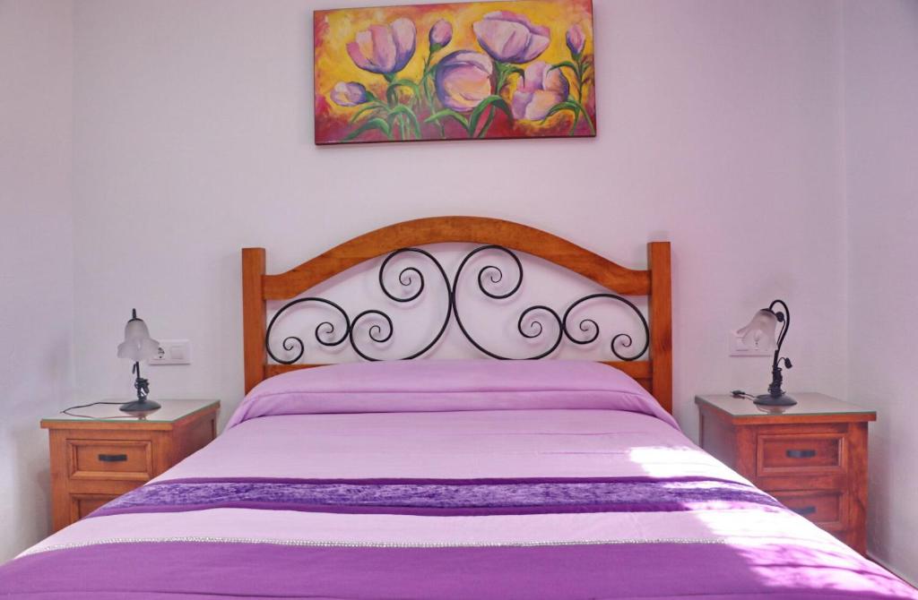 Łóżko lub łóżka w pokoju w obiekcie Chalet Vigía 114