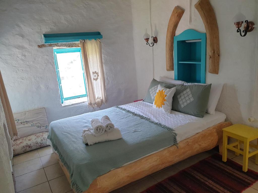 Postel nebo postele na pokoji v ubytování Güneş Butik Otel Datça