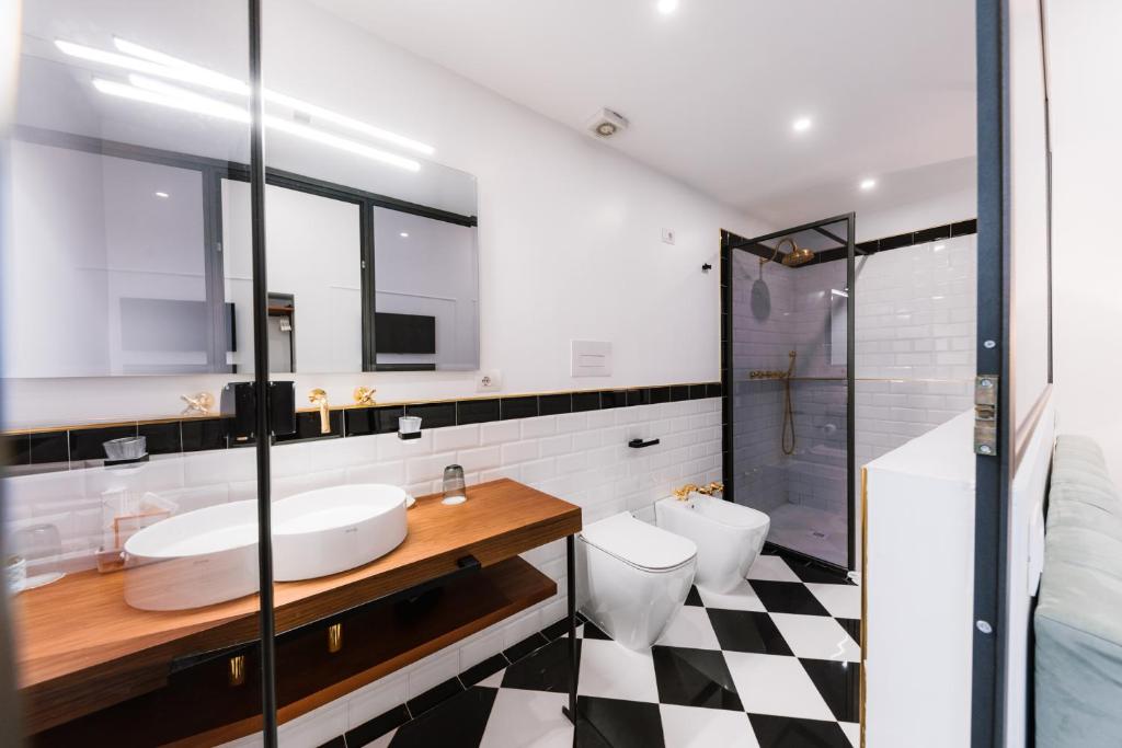 a bathroom with a sink and a toilet and a shower at Raggio di Sole in Maiori