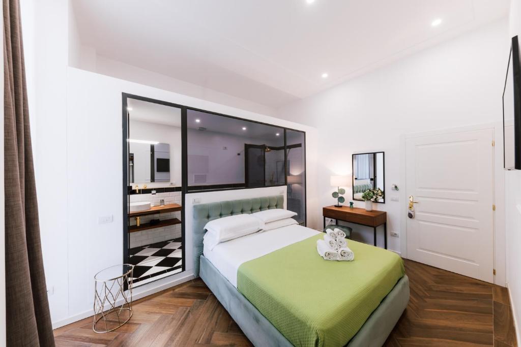 a bedroom with a large bed and a mirror at Raggio di Sole in Maiori