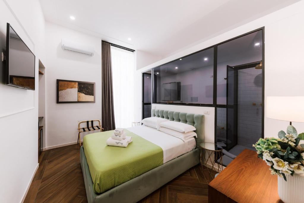 a hotel room with a bed and a table at Raggio di Sole in Maiori