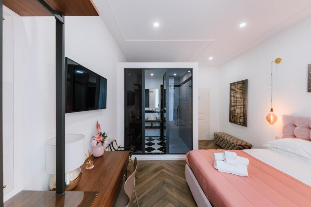 a bedroom with a large bed and a bathroom at Raggio di Sole in Maiori