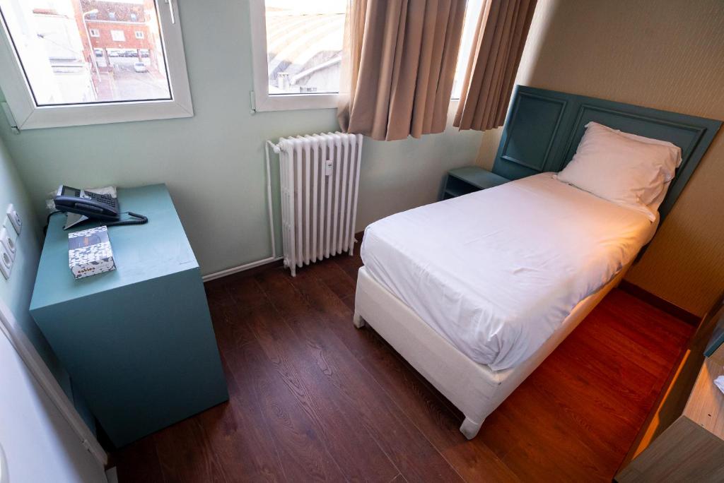 Postel nebo postele na pokoji v ubytování Breeze Hotel