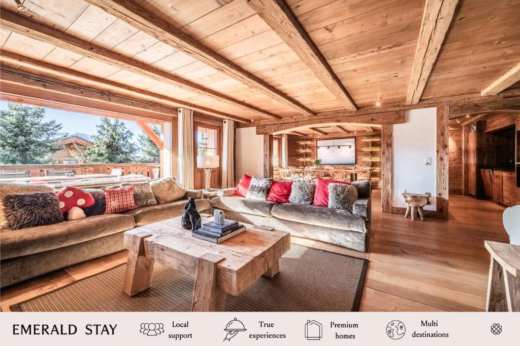a living room with couches and a table at Apartment Snowcrest, Verbier- by EMERALD STAY in Verbier