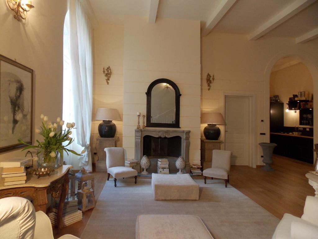 a living room filled with furniture and a large window at B&B Di Camilla in Pisa