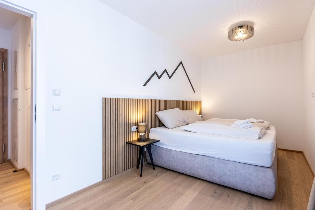 Postel nebo postele na pokoji v ubytování Alpine Suite Spot