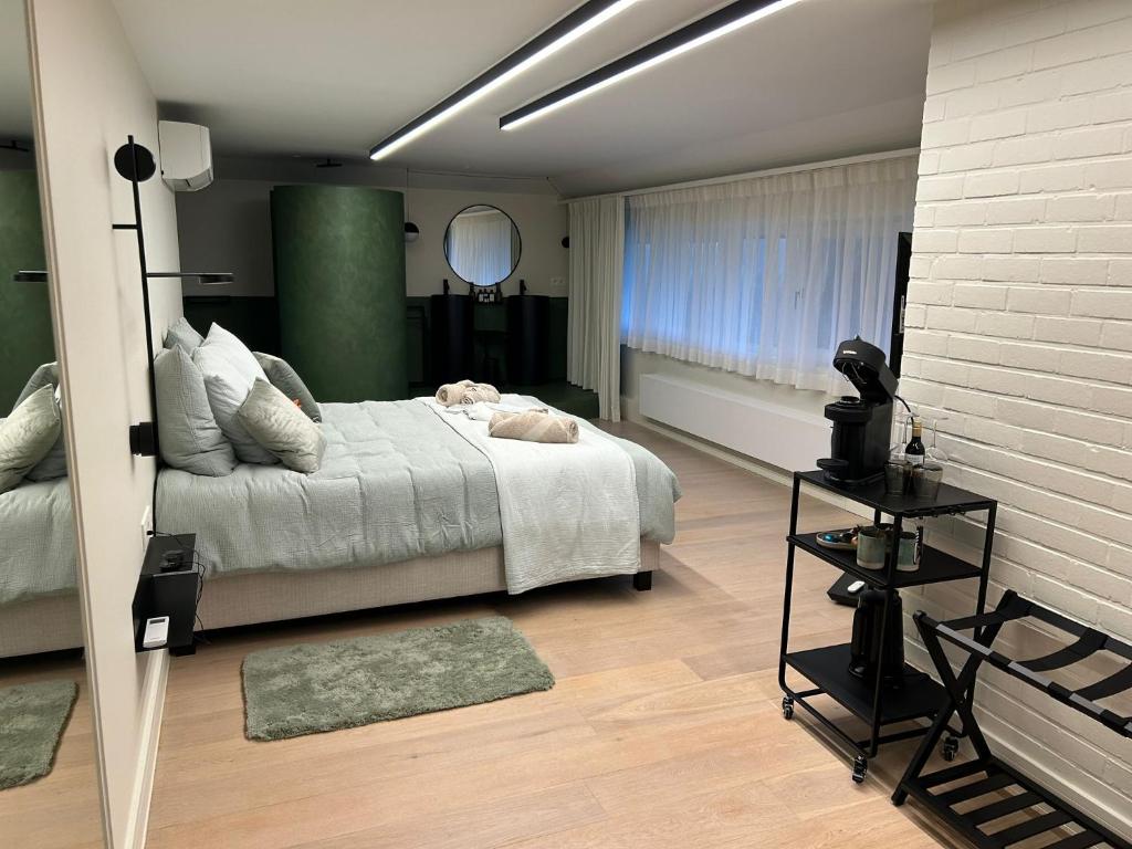 Postel nebo postele na pokoji v ubytování B&B De Alffarhoeve