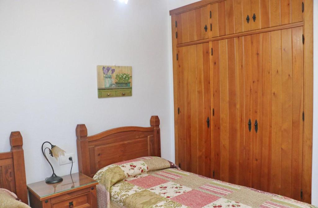 Łóżko lub łóżka w pokoju w obiekcie Chalet Vigía 113