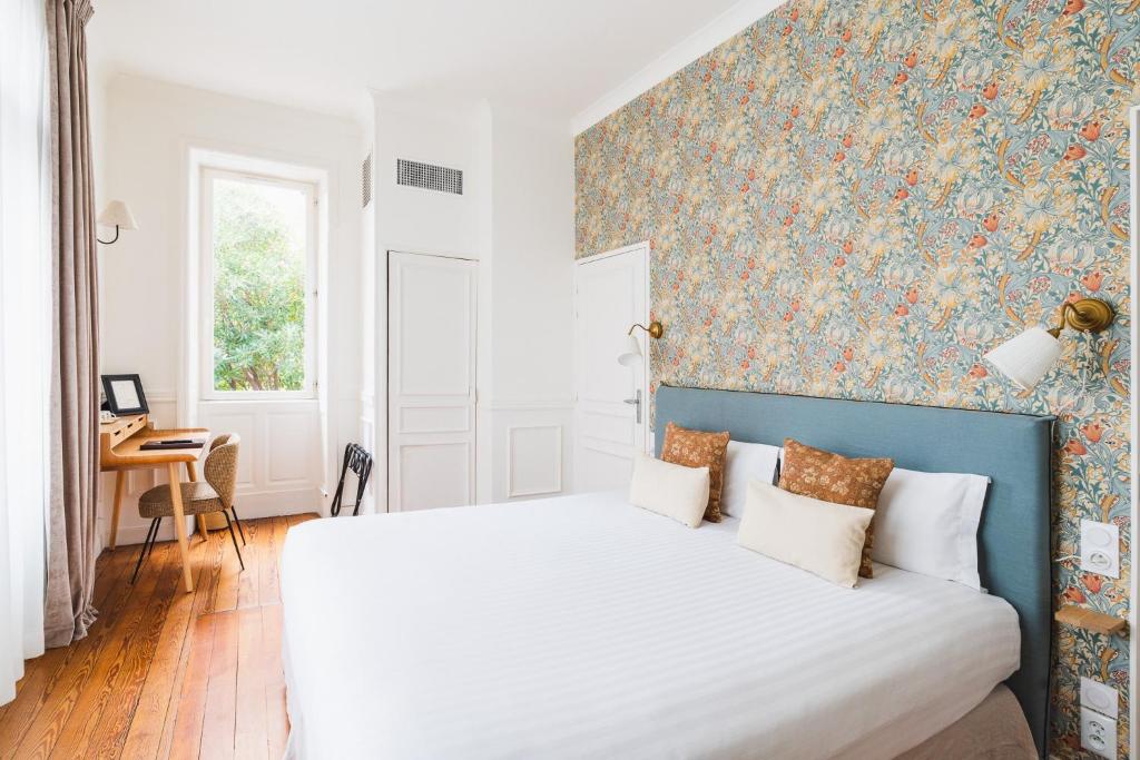Postel nebo postele na pokoji v ubytování Hotel Edouard VII