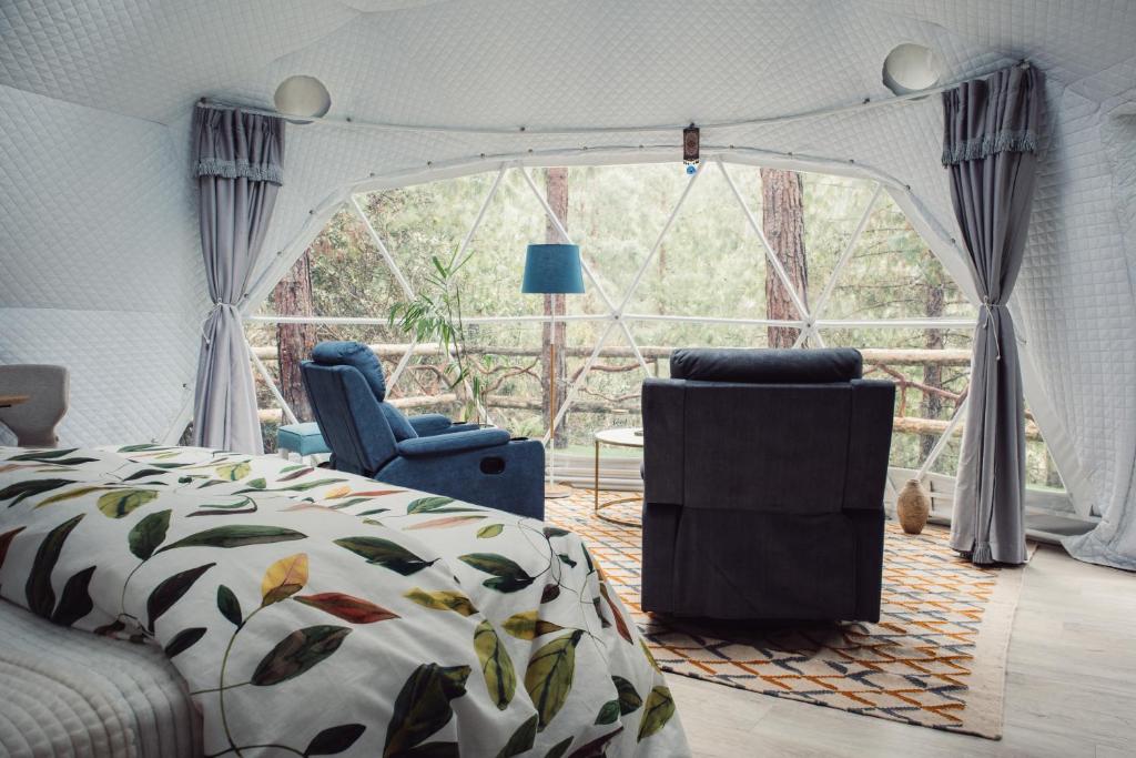 Postel nebo postele na pokoji v ubytování El Sendero Glamping