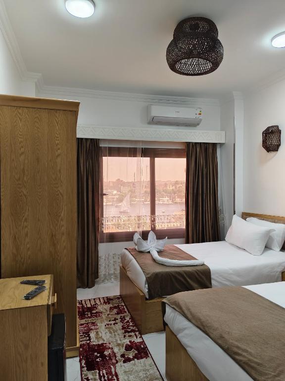 Postel nebo postele na pokoji v ubytování JJ Guesthouse