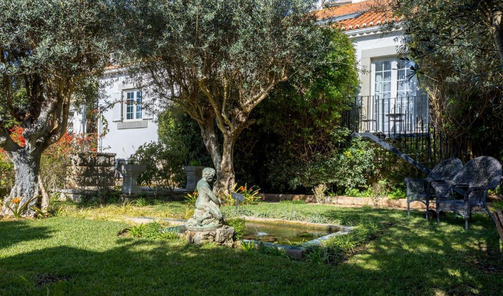 Um jardim em Casa Vela Boutique House