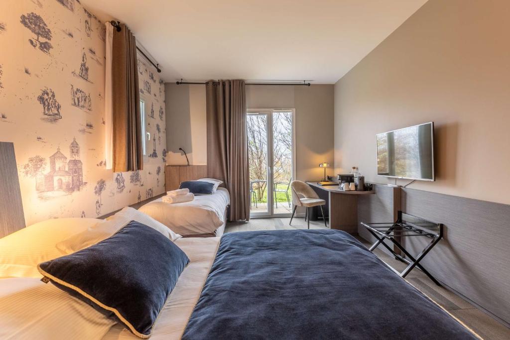 Postel nebo postele na pokoji v ubytování Best Western Plus Hôtel Gergovie