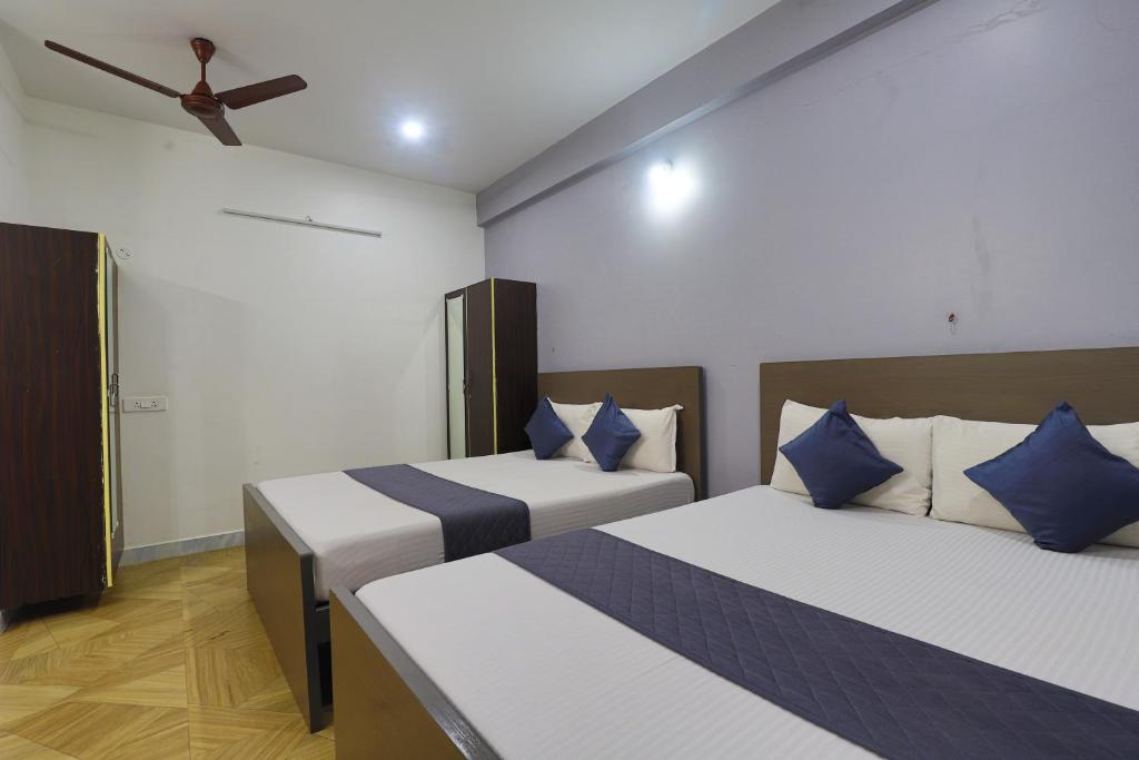 Postel nebo postele na pokoji v ubytování SS Guest House