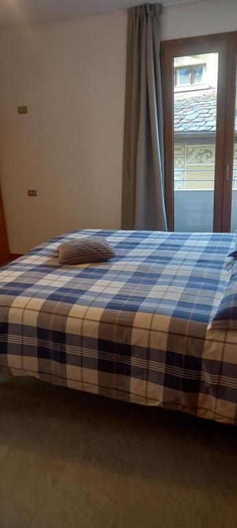 A bed or beds in a room at Appartamento Marco